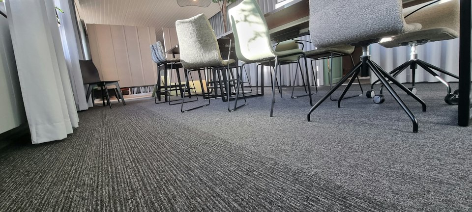 Conference space with neutral carpet tiles